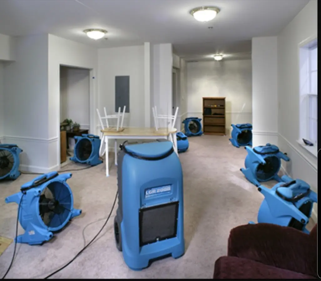 Air movers and dehumidifier setup for Water Damage Restoration in Tea